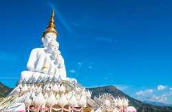 Five white amazing beautiful figure Buddha statues, small to big with the blue sky background. Photos at Wat Pha Sorn Kaew, Khao Kor, Phetchabun, Thailand, Buddhist monastery and public temple.