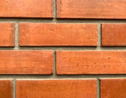 Close up Red brick cement wall.