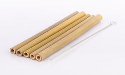 Bamboo straws on a white background. Ecological bamboo straws. Thanks to these bamboo straws, we can be a more environmentally conscious society. Say no to plastic.