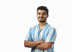 Indian handsome young adult wearing blue strip shirt and smiling isolated on white background 