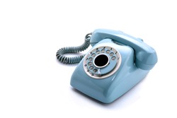 Old telephone on white background
