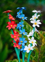 Colorful homemade origami paper flower, DIY floral paper craft, flower paper style, DIY home decoration.