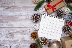 Calendar of December 2022; Christmas present box, a calendar, and ornament.