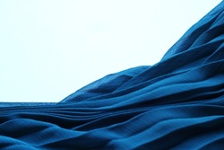 Blue silk fabric. Cyan tissue texture, textile with folds. Chiffon clothing on white background, 3d abstract sea waves