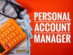 Selective focus of banknote,glasses and calculator with text PERSONAL ACCOUNT MANAGER on red background.Business concept.