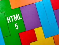 Business concept.Text HTML 5 writing on colored wooden puzzle.
