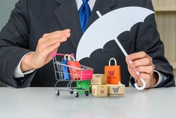 Consumer rights and consumer protection, business law concept : Buyer or purchaser protects bags and boxes of goods purchased online from internet retailer website, depicts caring on products bought