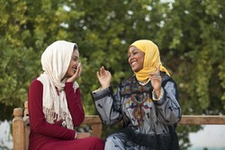 two Egyptian girl talking with each other