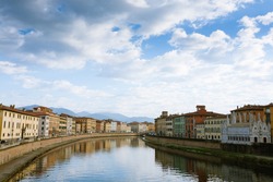 Pisa view. Buildings along Arno river. Italian landmark, Tuscany