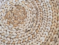 Abstract rattan texture. Background with round large weaving of straw. Textured bamboo background.