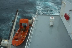 View of a merchant ships rescue boat secured on the boat deck