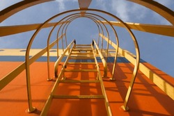 View of the funnel and the ladder to climb in a merchant ship at sea