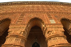  A view of intricate carvings on the terracotta pillars of the Temple of Madan Mohan.