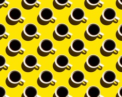 Pattern of coffee cups with shadow on yellow background. High quality photo