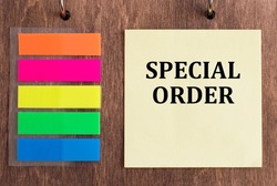 Text sign showing Special Order on a wooden background with colored stickers