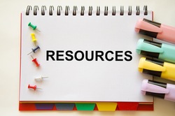 the resources text is written on a white notepad. Enterprise resource planning concept. Business structure and many business icons. High quality photo