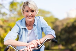 close up portrait of senior woman on a bicycle