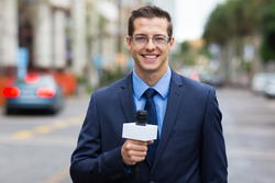 professional news reporter live broadcasting on urban street