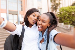 happy african college friends taking selfie together 