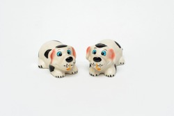 Ceramic figurines of dogs. Decor. Interior items. Ceramic products. Toy dogs isolated on white background. Porcelain toys.