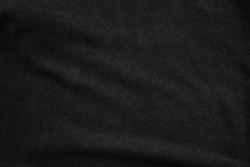 Black jumper fabric close up