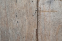 Old weathered discoloured stained building fence wood panel wall background close up texture
