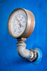 Pressure gauge (Pressure measurement) is measured by taking a reading from the dial. Industrial equipment, old rusted items that have been used.