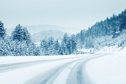 Mountain road landscape covered in snow in winter 