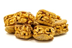 Stuffed dried figs. Dried figs stuffed with walnuts isolated on white background. Close-up. local name cevizli incir