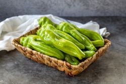 Sweet green peppers. Green peppers in a basket on a dark background. Vegetable, healthy vegan food. close up