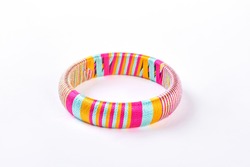 Cute vivid color bracelet. Girl trendy bangle isolated on white background. Multicolored stripes female bracelet.