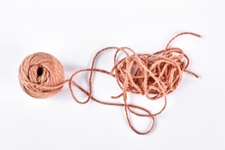 Ball of brown yarn on white background. Ball of yarn isolated on white background. Ball of knitting thread.