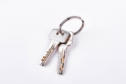 Doors keys isolated on white background. Twor keys on metal keyring isolated on white background.