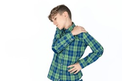 caucasian kid boy wearing plaid shirt got back pain