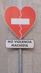 Heart-shaped sign with a message in Spanish  against gender-based violence (