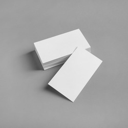 Blank white business cards on gray paper background. Mockup for ID. Template for graphic designers portfolios.