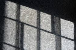 Light and shadows of window steel.  Jail, prison, catch, control, limit, arrest, confusing, no way out concepts.