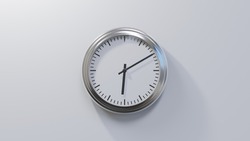 Glossy chrome clock on a white wall at ten past six. Time is 06:10 or 18:10