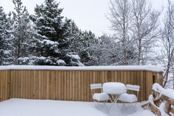 Backyard covered in white winter snow.