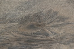 drawing in the sand at low tide