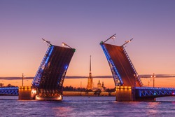 Opening of Palace drawbridge, White nights in Saint Petersburg, view of Peter and Paul Cathedral through the bridge