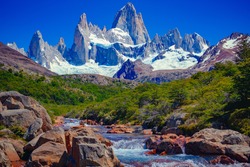 A unique and beautiful scenery: a blue river in El Chaltén, Patagonia, and Mount Fitz Roy in the background. Located at the Southern Patagonic Andes between Chile and Argentina. 