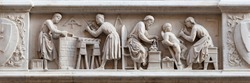 Master stonemasons, woodcarvers, and sculptors, represented in a bas-relief (1408) on the external facade of the Orsanmichele Church, Florence, Italy
