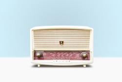 Vintage radio on pastel blue background