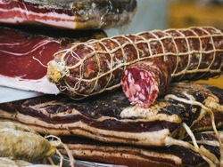food counter, selling Italian cured meats. Italian salami close up