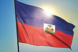 Haiti flag waving on the wind in front of sun