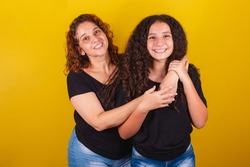 Grandmother and niece, Brazilian caucasian, curly, smiling, hugging, family photo, beautiful. Mother's Day, Fraternity, Love.
