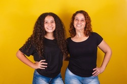 Grandmother and niece, Brazilian caucasian, curly, smiling, hands on hips, family photo, beautiful. Mother's Day, Fraternity, Love.