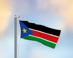 Flag Of South Sudan waving in the wind and hoisted on a flagpole with white ropes and clear sky background
