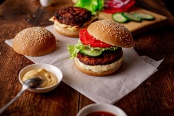 Ingredients for hamburger, cheeseburger. Wooden background. Home cooking hamburger. Food concept. Hamburger day.